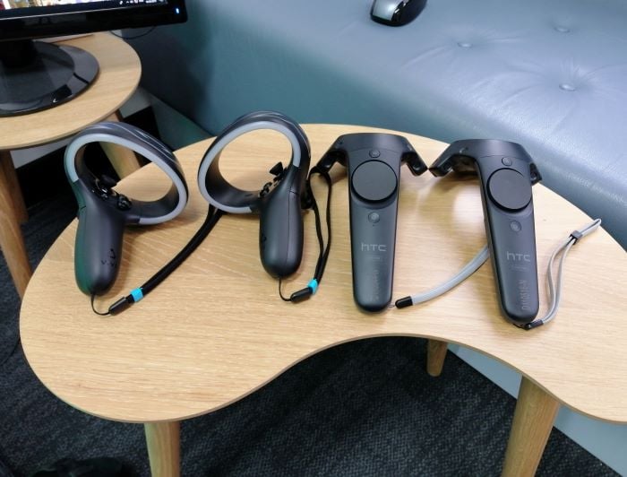 HTC VIVE Cosmos controllers next to original VIVE controllers HTC VIVE Cosmos controllers next to original VIVE controllers