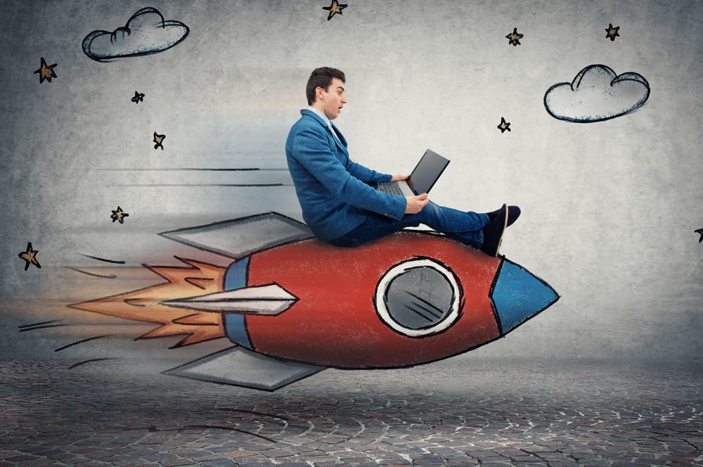 Man with laptop on rocket Man with laptop on rocket