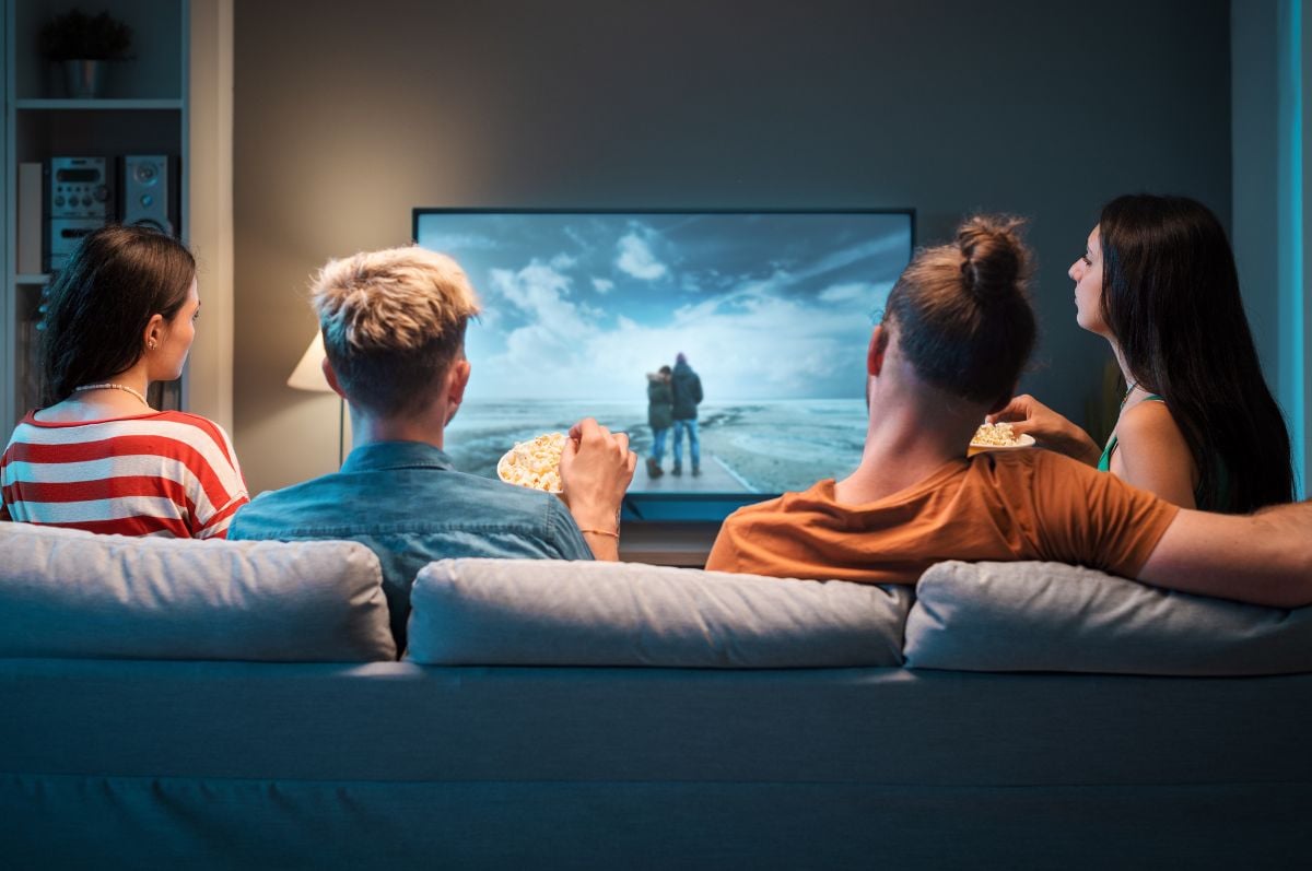 Friends watching TV together Friends watching TV together