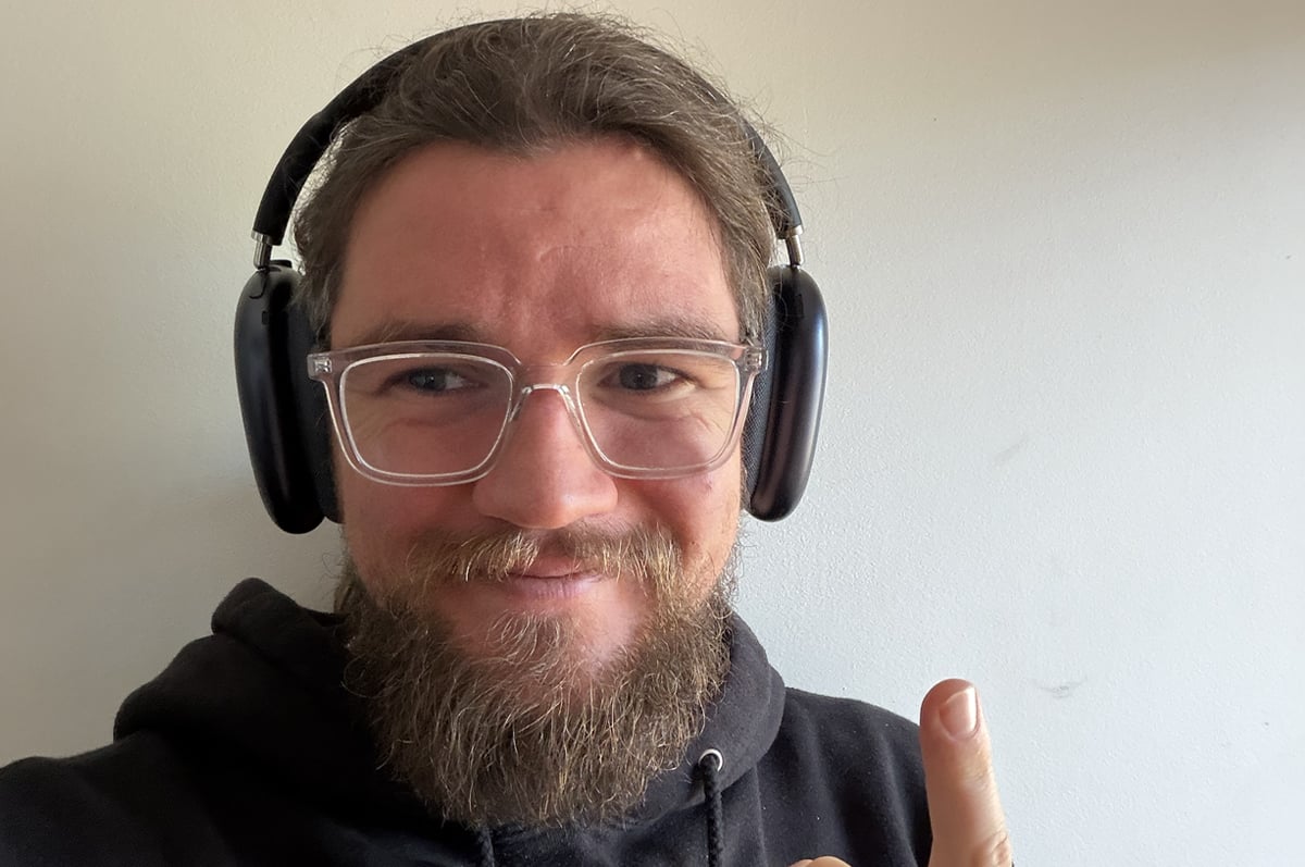 the author wearing AirPods Max 2 the author wearing AirPods Max 2