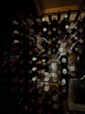 Pixel 11 Pro camera sample of wine rack in low light